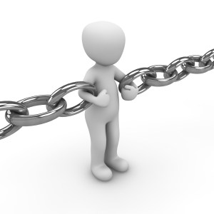 figure held by chain